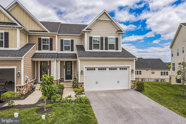 718 Quarry Point Rd, Malvern, PA 19355 - view of front of property with roof with shingles, a garage, stone siding, a front yard, and asphalt driveway