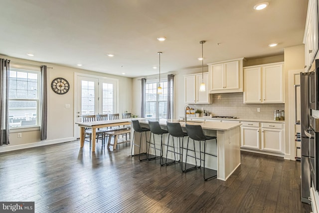 718 Quarry Point Rd, Malvern, PA 19355 - kitchen with dark wood-style floors, gas cooktop, healthy amount of natural light, white cabinets, and recessed lighting