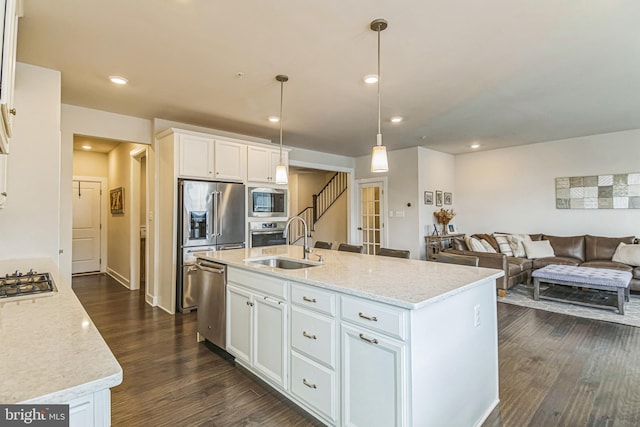 718 Quarry Point Rd, Malvern, PA 19355 - kitchen featuring a sink, stainless steel appliances, dark wood-style flooring, white cabinetry, and open floor plan