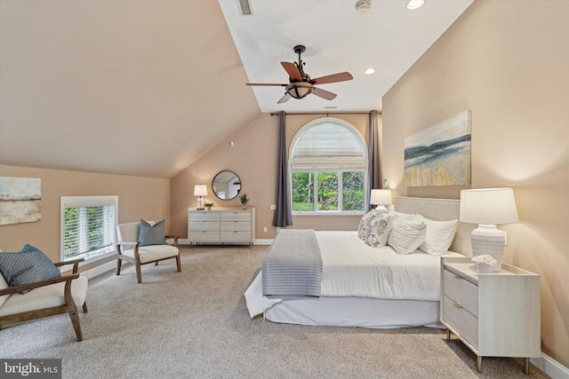 carpeted bedroom featuring multiple windows, vaulted ceiling, baseboards, recessed lighting, and a ceiling fan