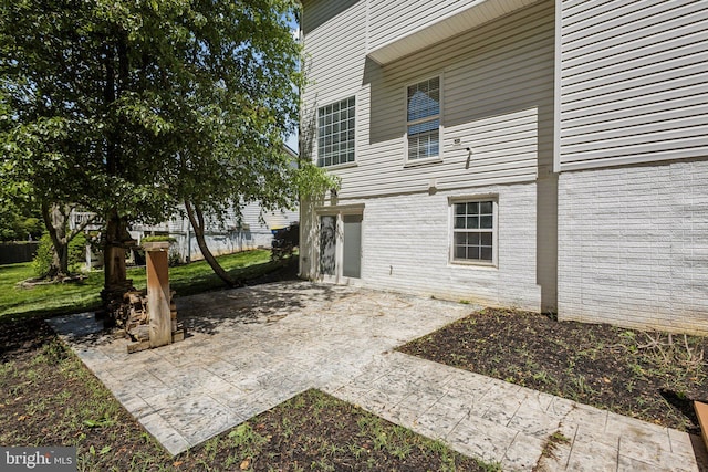 back of property with a patio