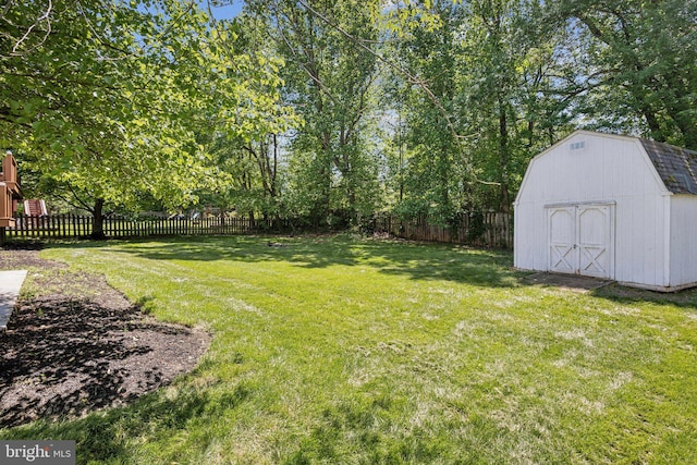 view of yard with a storage shed and an outbuilding