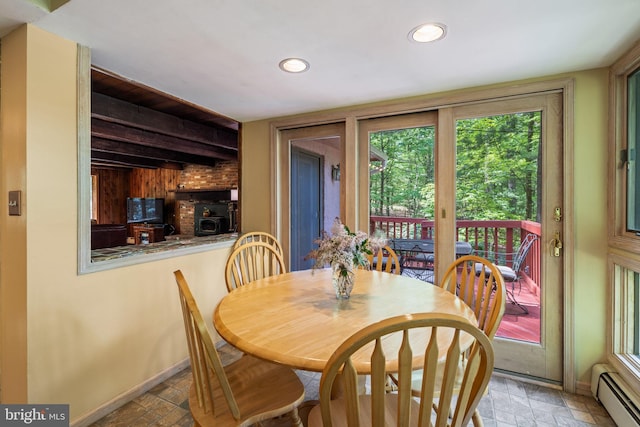 dining area featuring baseboard heating, recessed lighting, and baseboards