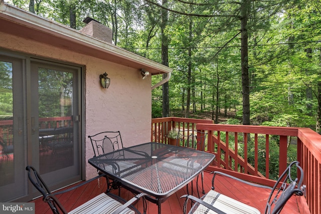 deck with outdoor dining area
