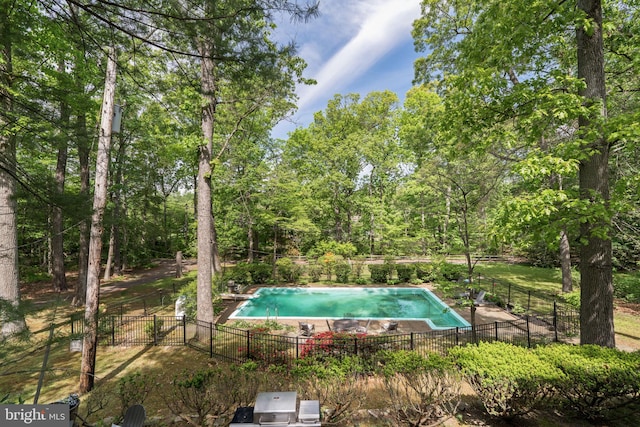 view of pool with fence