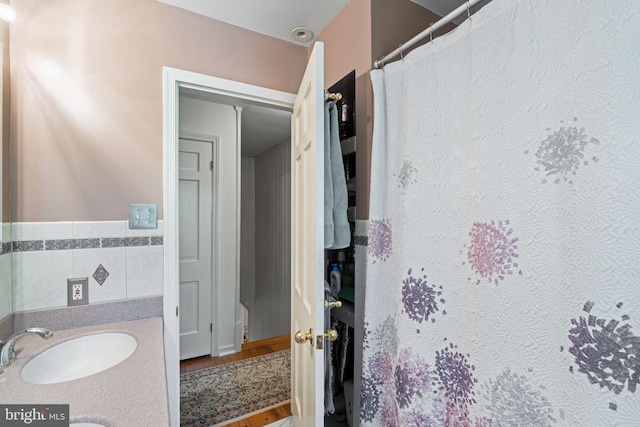 full bath with wood finished floors and vanity