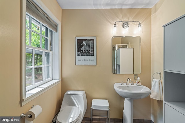 bathroom featuring toilet and a sink