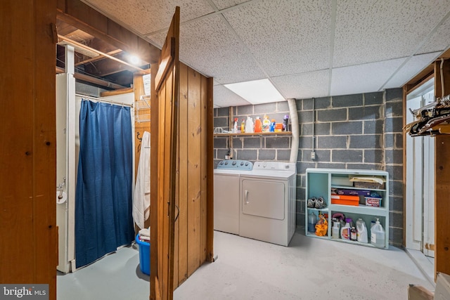 clothes washing area featuring washing machine and clothes dryer