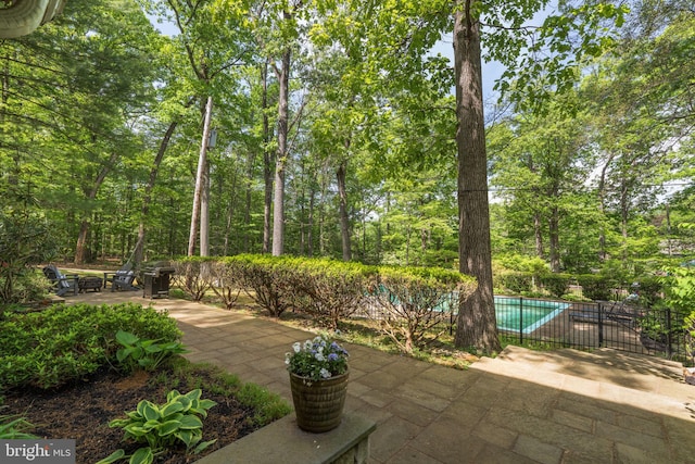 view of patio featuring fence