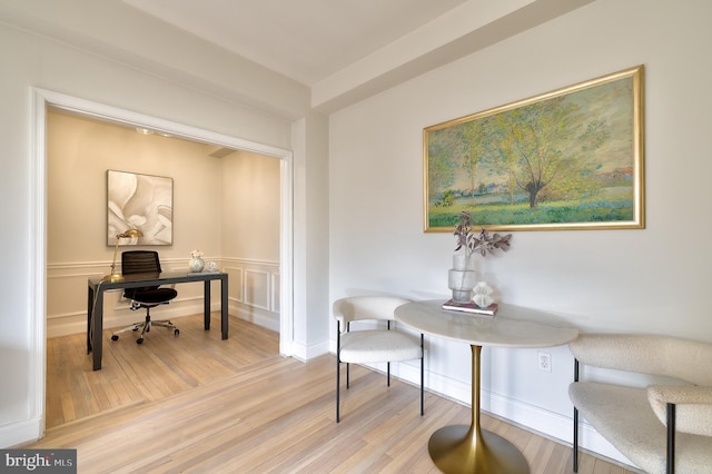 home office with light wood-style floors