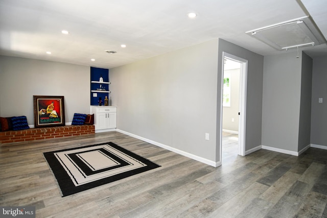 1210 Lindsay Rd, Oxon Hill, MD 20745 - basement featuring recessed lighting, wood finished floors, and baseboards