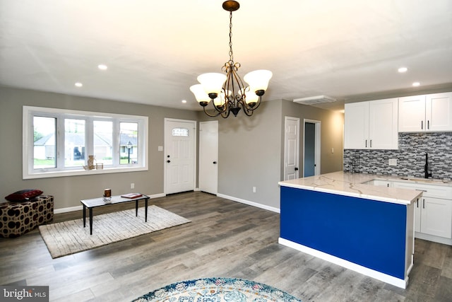 1210 Lindsay Rd, Oxon Hill, MD 20745 - kitchen featuring a sink, white cabinetry, recessed lighting, a chandelier, and light stone counters