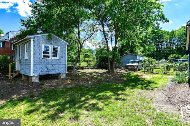 1210 Lindsay Rd, Oxon Hill, MD 20745 - view of yard with an outdoor structure and entry steps