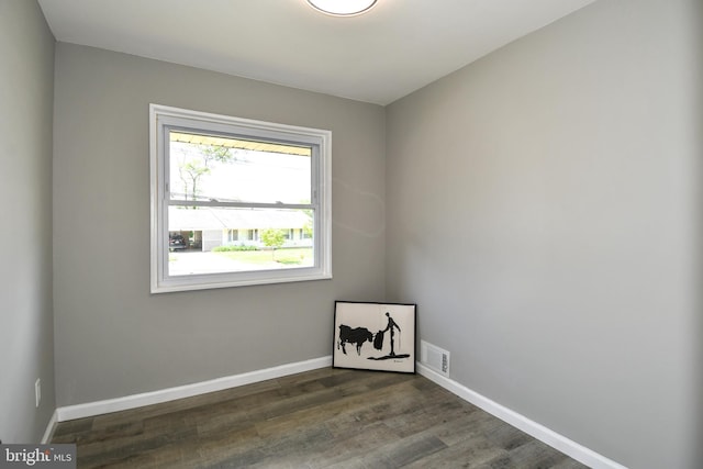 1210 Lindsay Rd, Oxon Hill, MD 20745 - empty room with dark wood-style floors and baseboards
