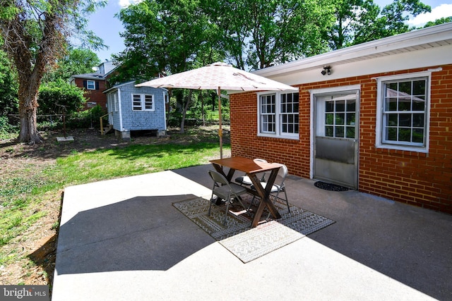 1210 Lindsay Rd, Oxon Hill, MD 20745 - view of patio / terrace featuring an outbuilding and a storage shed