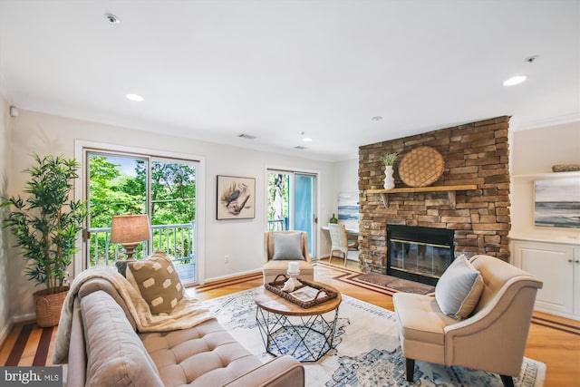 1233 Boucher Ave, Annapolis, MD 21403 - living area with a fireplace, crown molding, baseboards, light wood-style floors, and recessed lighting