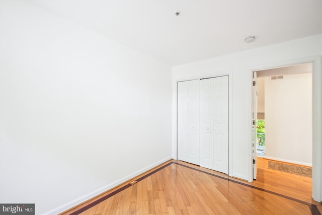 1233 Boucher Ave, Annapolis, MD 21403 - unfurnished bedroom with light wood-style flooring, a closet, and baseboards