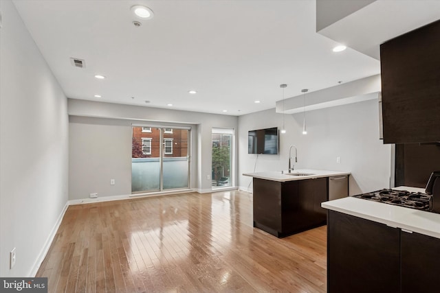 1524 N 2nd St Unit 2, Philadelphia, PA 19122 - kitchen with a sink, modern cabinets, dark brown cabinets, light countertops, and recessed lighting