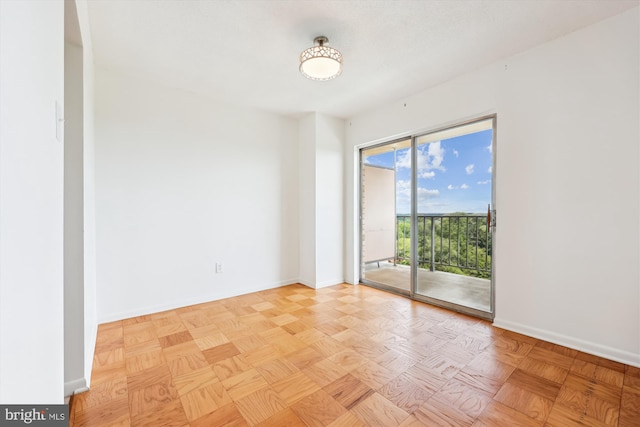 spare room featuring baseboards