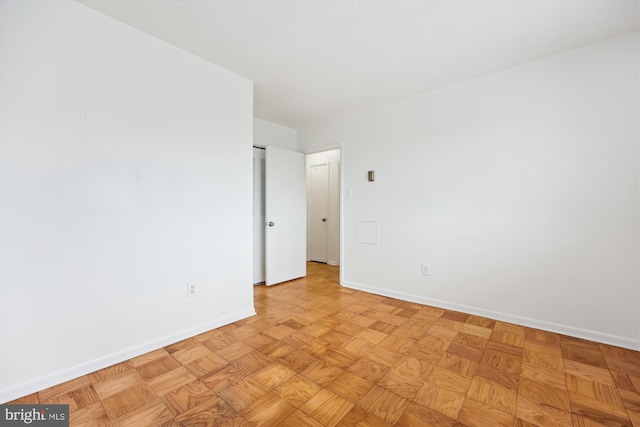 empty room with baseboards