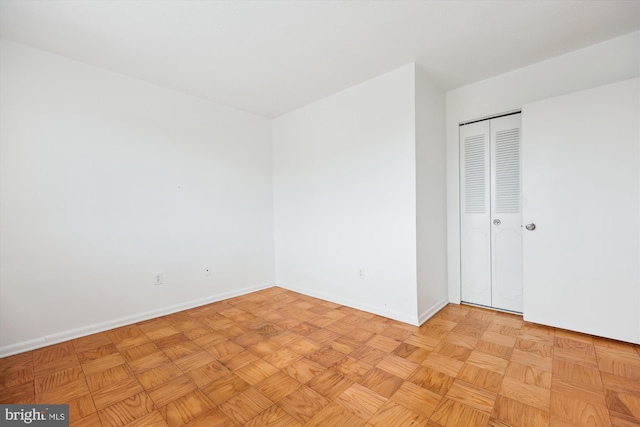 spare room featuring baseboards