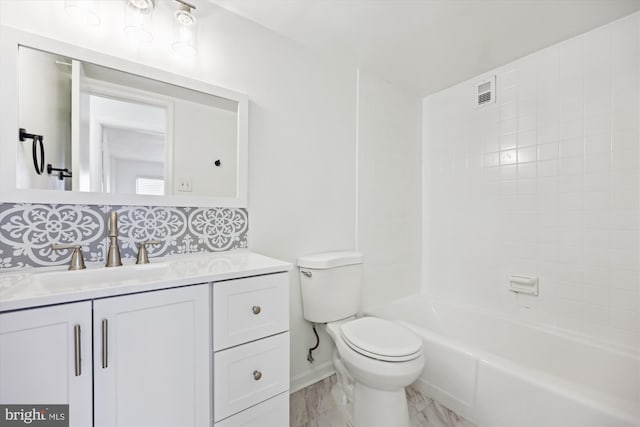 bathroom with toilet, vanity, backsplash, marble finish flooring, and baseboards