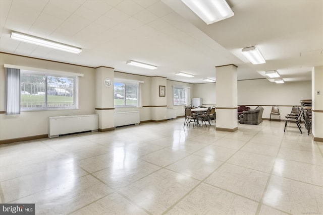 miscellaneous room featuring radiator heating unit and baseboards