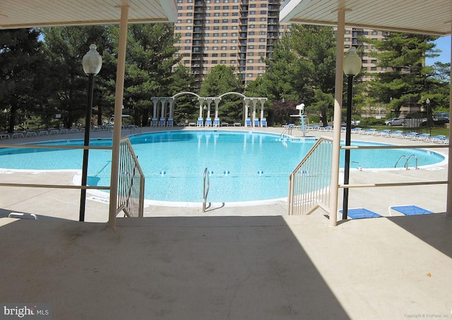 community pool featuring a patio