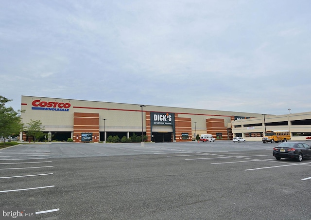 view of commercial property with uncovered parking
