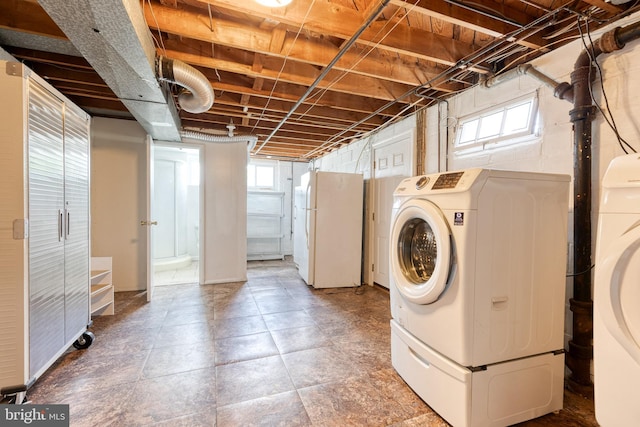 laundry area with plenty of natural light and washer and dryer