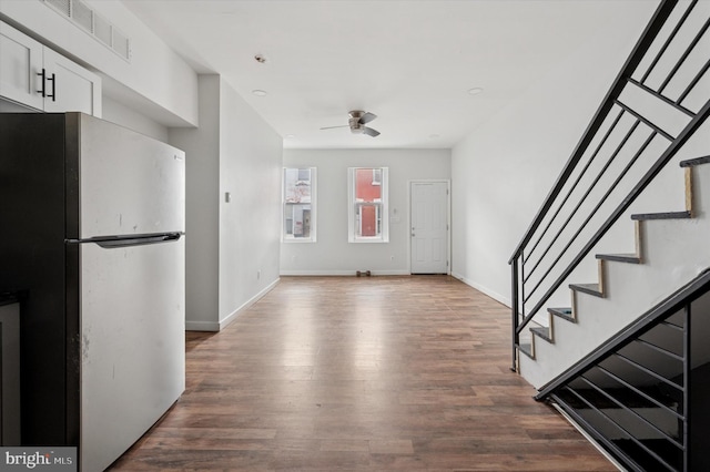 2214 N Cleveland St, Philadelphia, PA 19132 - kitchen featuring freestanding refrigerator, a ceiling fan, white cabinetry, dark wood finished floors, and baseboards