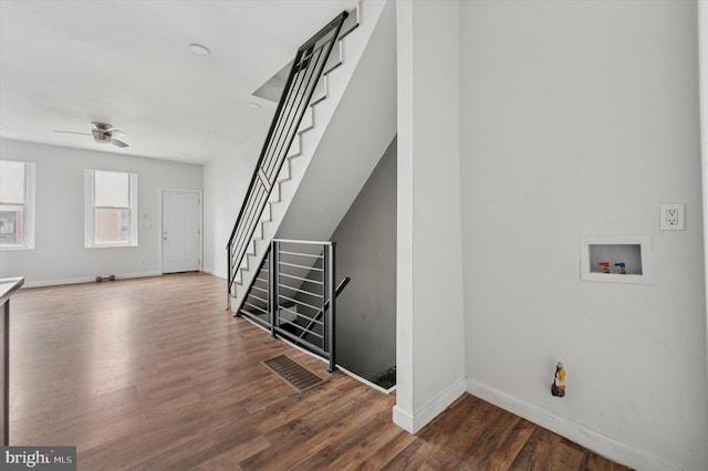 2214 N Cleveland St, Philadelphia, PA 19132 - unfurnished living room with wood finished floors, baseboards, and stairway