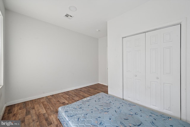2214 N Cleveland St, Philadelphia, PA 19132 - unfurnished bedroom with wood finished floors, a closet, and baseboards