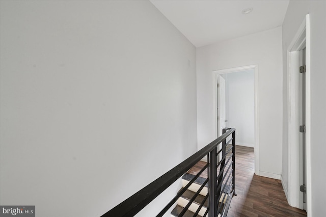 2214 N Cleveland St, Philadelphia, PA 19132 - corridor featuring an upstairs landing, dark wood-style floors, and baseboards