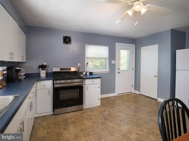 718 Moore Ave, Bryn Mawr, PA 19010 - kitchen featuring stainless steel range with gas stovetop, dark countertops, and white cabinetry