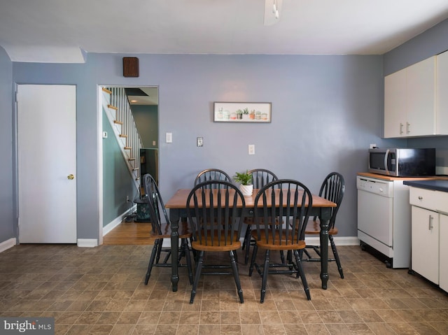 718 Moore Ave, Bryn Mawr, PA 19010 - dining area featuring stairway and baseboards