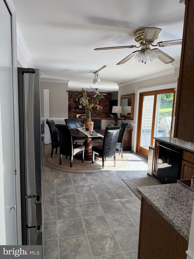 dining room featuring ornamental molding, ceiling fan, and stone finish flooring