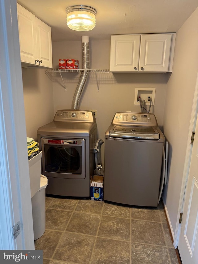 laundry area with cabinet space and washing machine and dryer
