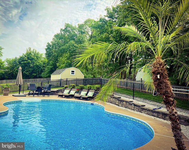 view of swimming pool with fence and a patio