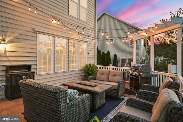 4108 Brushfield Dr, Frederick, MD 21704 - deck at dusk with an outdoor living space and area for grilling