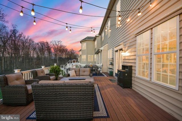 4108 Brushfield Dr, Frederick, MD 21704 - deck at dusk featuring an outdoor living space and outdoor dining space