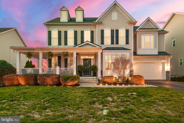 4108 Brushfield Dr, Frederick, MD 21704 - view of front of property featuring asphalt driveway, covered porch, a garage, and a lawn