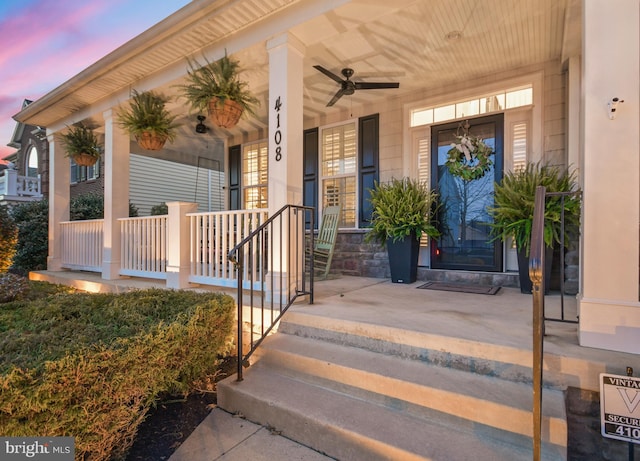 4108 Brushfield Dr, Frederick, MD 21704 - view of exterior entry with a porch, stone siding, and ceiling fan