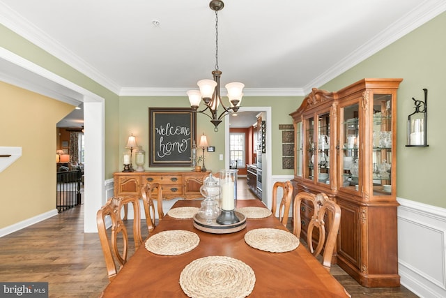 4108 Brushfield Dr, Frederick, MD 21704 - dining area featuring a chandelier, wood finished floors, crown molding, and wainscoting