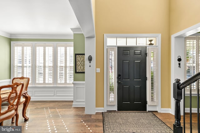 4108 Brushfield Dr, Frederick, MD 21704 - entrance foyer with ornamental molding, wood finished floors, stairway, and wainscoting