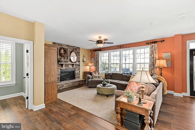 4108 Brushfield Dr, Frederick, MD 21704 - living area featuring healthy amount of natural light, a fireplace, and dark wood-style floors