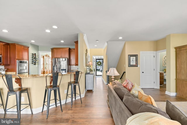 4108 Brushfield Dr, Frederick, MD 21704 - living area featuring wood finished floors, recessed lighting, and baseboards