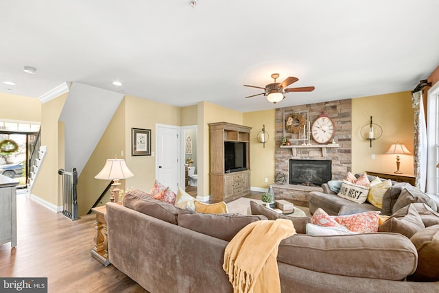 4108 Brushfield Dr, Frederick, MD 21704 - living room with healthy amount of natural light, ceiling fan, light wood-style flooring, a fireplace, and recessed lighting