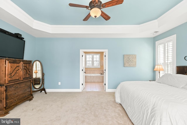 4108 Brushfield Dr, Frederick, MD 21704 - carpeted bedroom featuring a tray ceiling, baseboards, and connected bathroom