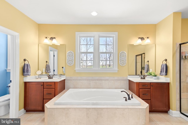4108 Brushfield Dr, Frederick, MD 21704 - full bathroom featuring tile patterned floors, a garden tub, toilet, and two vanities